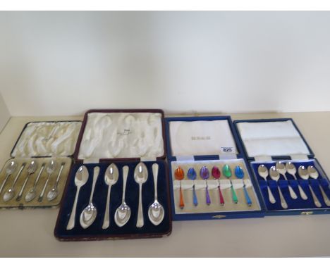 A set of six silver teaspoons, six enamel silver spoons, six enamel plated spoons and six plated grapefruit spoons, all ename