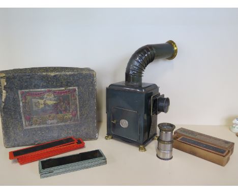 An E P Magic lantern with a selection of slides and a box, no burner 