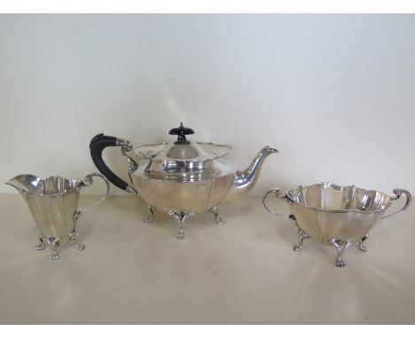 A three piece silver tea set Birmingham 1905/6 Maker J. R. Ltd, total weight approx 29.8 troy oz, all clean and no engraving,