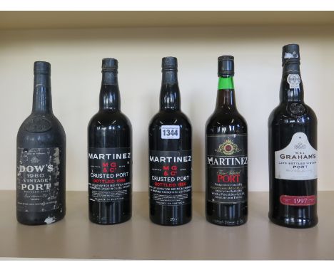 A Dow’s 1980 vintage port together with four other bottles of port including a 1997 Graham’s late bottled Vintage, some damag