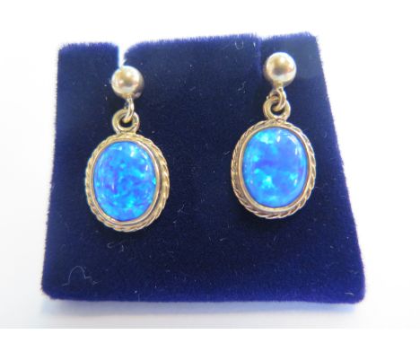 A pair of 9ct yellow gold opal drop earrings, total drop 2cm, approx 2 grams - new condition, ex jewellers stock 