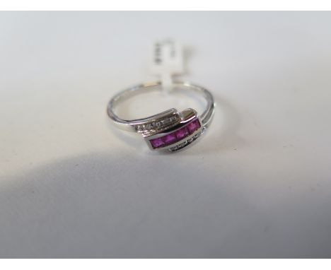 A hallmarked 9ct white gold diamond and ruby ring, size P - approx 2 grams - new condition, ex jewellers stock 