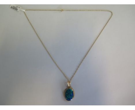 A hallmarked 9ct yellow gold opal pendant on a 40cm chain, approx 3.4 grams, new condition, ex jewellers stock 