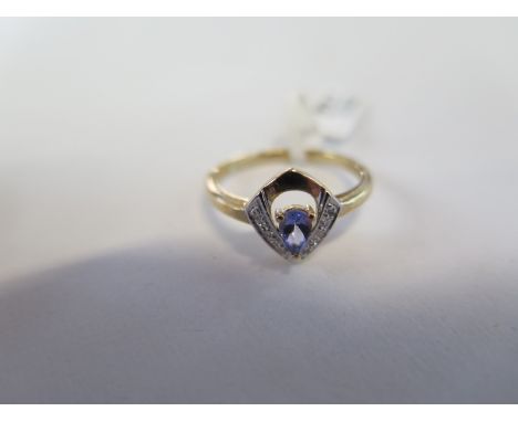 A hallmarked 9ct yellow gold tanzanite and diamond ring, size N, approx 1.8 grams, new condition, ex jewellers stock 
