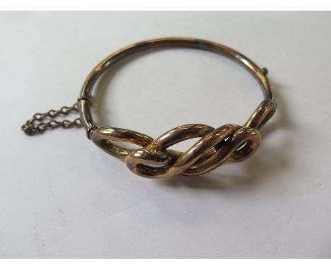 A 9ct yellow gold hollow bangle marked 9ct approx 11.5 grams, some denting but no breaks 