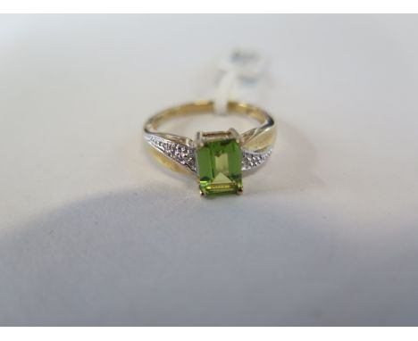 A hallmarked 9ct yellow gold peridot and diamond ring, size L, approx 2.3 grams - new condition, ex jewellers stock 