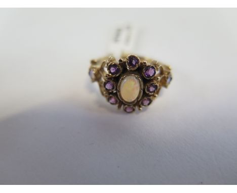 A hallmarked 9ct yellow gold opal and amethyst ring, size N, approx 3.3 grams, new condition, ex jewellers stock 