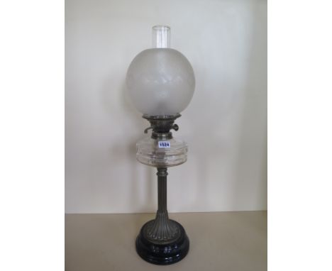 An oil lamp with clear glass font and etched globe shade, 65cm tall, generally good 