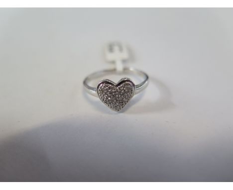 A 9ct white gold diamond heart ring, approx 0.05ct, ring size M - approx 1.9 grams, marked 9K - new condition, ex jewellers s