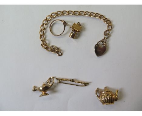 A 9ct hallmarked gold chain, 17cm long, a hallmarked 9ct gold charm, a 9ct gold ring missing its stone, total weight approx 1