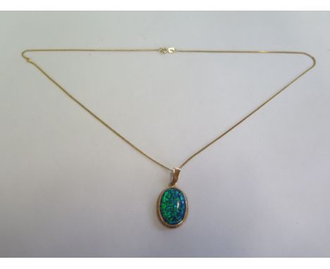 A hallmarked 9ct yellow gold opal pendant, in a 44cm chain, approx 4.3 grams, new condition, ex jewellers stock 