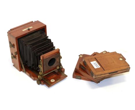 The 1897 Instantograph Quarter Plate Camera mahogany body with brass fittings and retailer's plaque 'A Franks Optician Manche