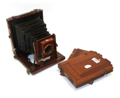 Thornton Pickard Half Plate Camera mahogany body with brass fitting, with two plate holders no lens