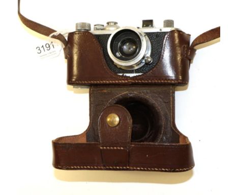 Leica Standard Camera no.312660 with lens stamped 'Wallace Heaton' in leather caseCosmetically worn, shutter working