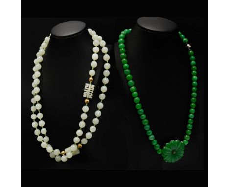 TWO JADE NECKLACES. comprising a nephrite white jade bead necklace, with Chinese oblong carved beads set between gold plated 