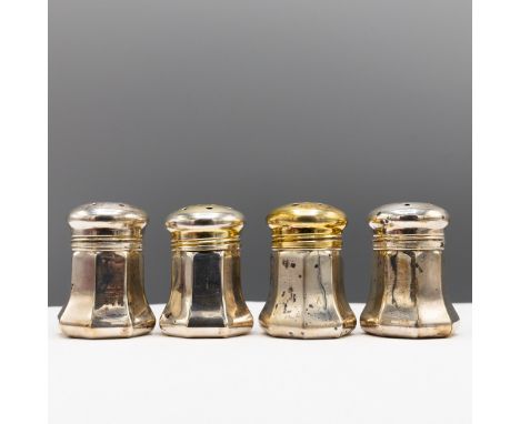 A CARTIER STERLING SILVER SALT AND PEPPER SET. comprising four salt and pepper pots, each of octagonal splayed form, each 4cm