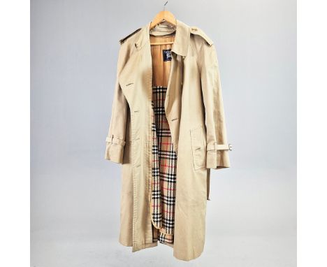 RARE VINTAGE BURBERRYS TRENCH COAT. with a separate detachable Burberry check cape lining which can be worn separately, signa