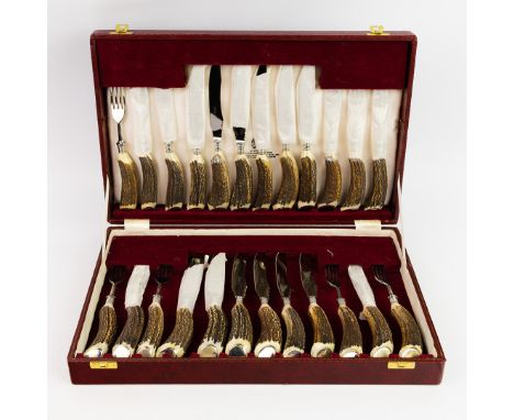 ASPREY LONDON. A BOXED SET OF STAG HANDLED KNIVES AND FORKS. box: 42cm x 26cm.