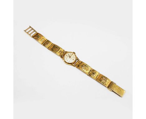 AN EXACTUS 18CT GOLD WRIST WATCH. having a 17 jewelled movement, champagne dial, serial number to back '5544', the gold strap