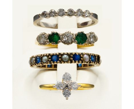 A COLLECTION OF ASSORTED DRESS RINGS. comprising an 18ct gold emerald and diamond five stone ring, an 18ct white gold six sto