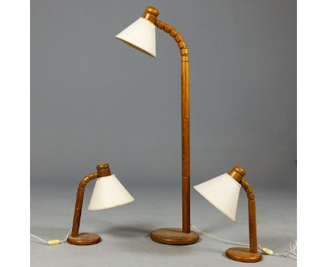 THREE SWEDISH ARTICULATED PITCH PINE LAMPS (3). Circa 1970, floor lamp, 144cm H, table lamps, 53cm H.