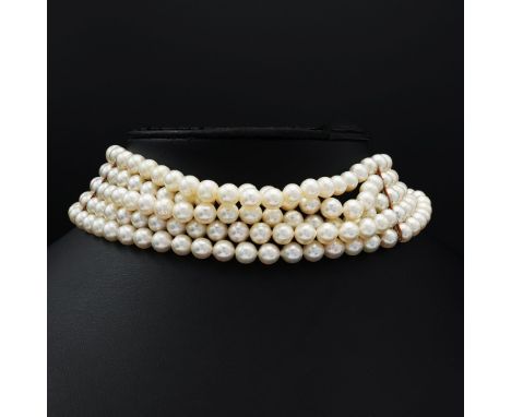 A FIVE STRAND CULTURED PEARL CHOKER NECKLACE. having approximately 249 round 7mm pearls, yellow metal spacers, fitted with a 