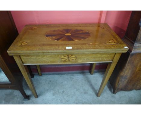 A George III inlaid oak rectangular fold over card table 