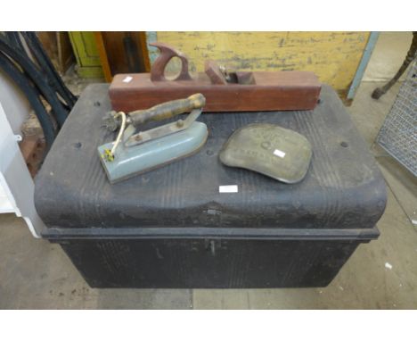 A steel chest with vintage iron, Richmond &amp; Son brass sign and a wood smoothing plane 