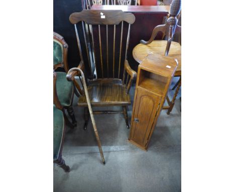 A mahogany rocking chair, a walking stick and small cupboard 