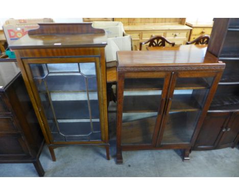 An Art Deco oak two door bookcase and an Edward VII mahogany display cabinet 