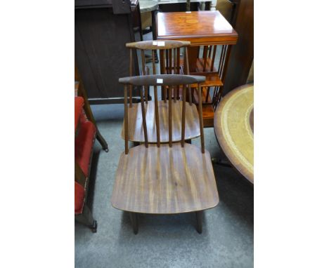 A pair of vintage teak stickback chairs 
