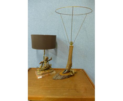 A gilt cherub table lamp and a taxidermy deer hoof table lamp 