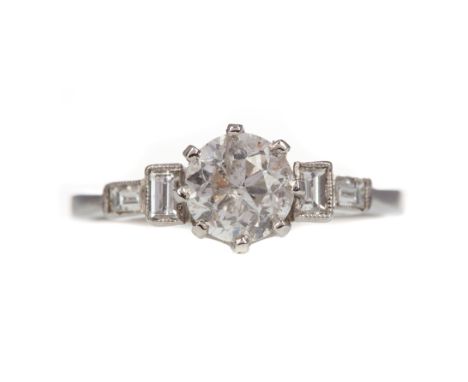 DIAMOND DRESS RING, set with a round brilliant cut diamond of approximately 1.07 carats, flanked by two baguette cut diamonds