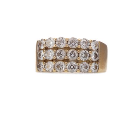 DIAMOND DRESS RING, with three rows of round brilliant cut diamonds totalling approximately 2.00 carats, 10mm wide, in eighte