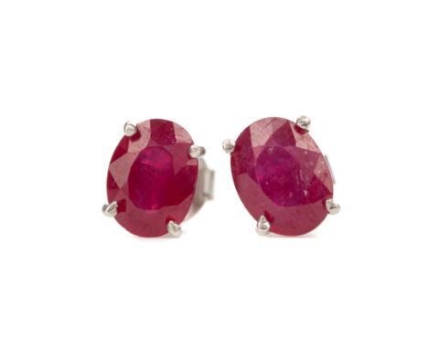 PAIR OF TREATED RUBY EARRINGS, set with oval treated ruby stones 7mm long, in silver, 1.7g