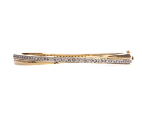 DIAMOND BANGLE, set with round brilliant cut diamonds totalling approximately 0.98 carats, marked 750, 23.7g