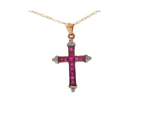RUBY AND DIAMOND CROSS PENDANT, set with princess cut rubies with diamond chips to the terminals, in nine carat gold, on a ch