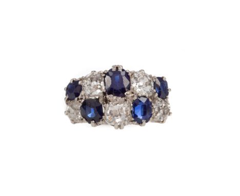 SAPPHIRE AND DIAMOND RING, set with two rows of alternating sapphires and old mine cut diamonds totalling very approximately 