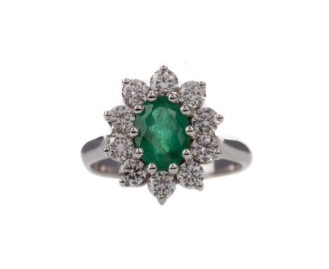 CERTIFICATED EMERALD AND DIAMOND RING, set with an oval emerald of approximately 1.40 carats, with evidence of oiling, within