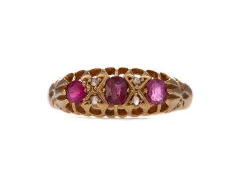 PARTIAL RUBY AND DIAMOND RING, set with three rubies interspaced by pairs of diamond chips, central ruby does sit in the sett