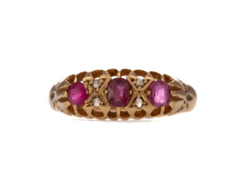 PARTIAL RUBY AND DIAMOND RING, set with three rubies interspaced by pairs of diamond chips, central ruby does sit in the sett