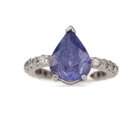 TANZANITE AND DIAMOND RING, the pear shaped tanzanite of approximately 4.91 carats, on a full diamond set band totalling appr