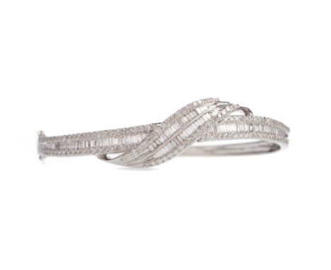 DIAMOND BANGLE, set with round brilliant and baguette cut diamonds totalling approximately 2.17 carats, in eighteen carat whi