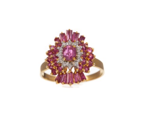 RUBY AND DIAMOND RING, set with oval, tapered baguette and round rubies, with round brilliant cut diamonds totalling approxim