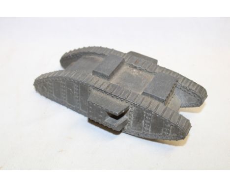 An unusual First War solid diecast metal model of a British tank, 6½" long