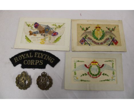 An original First War cloth Royal Flying Corps shoulder title, brass RFC cap badge, two RFC embroidered silk First War postca