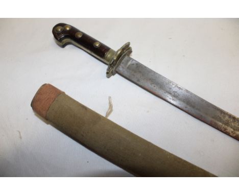 A 19th century Russian short sword with curved 21" single edged blade, brass eagle decorated guard and polished wood grips in