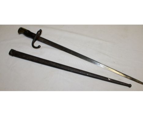 A French Gras bayonet with triangular steel blade marked "D'armes de Chat Nov.1875" in steel scabbard