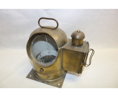 A small German nautical compass by W. Ludolph of Bremerhaven in binnacle housing with oil fitment 9½" high