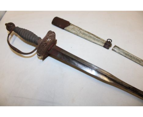 An 18th century small sword with 32" triangular tapered blade etched with varying designs, steel double oval pierced guard an